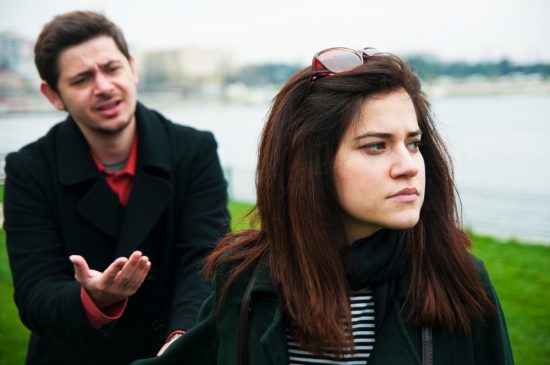 Young Man Pleading with Angry Young Woman