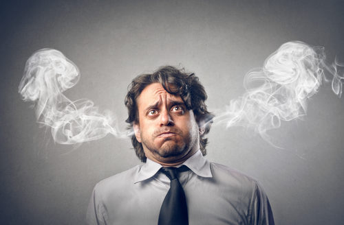 Stressed Out Businessman with Smoke Coming from Ears