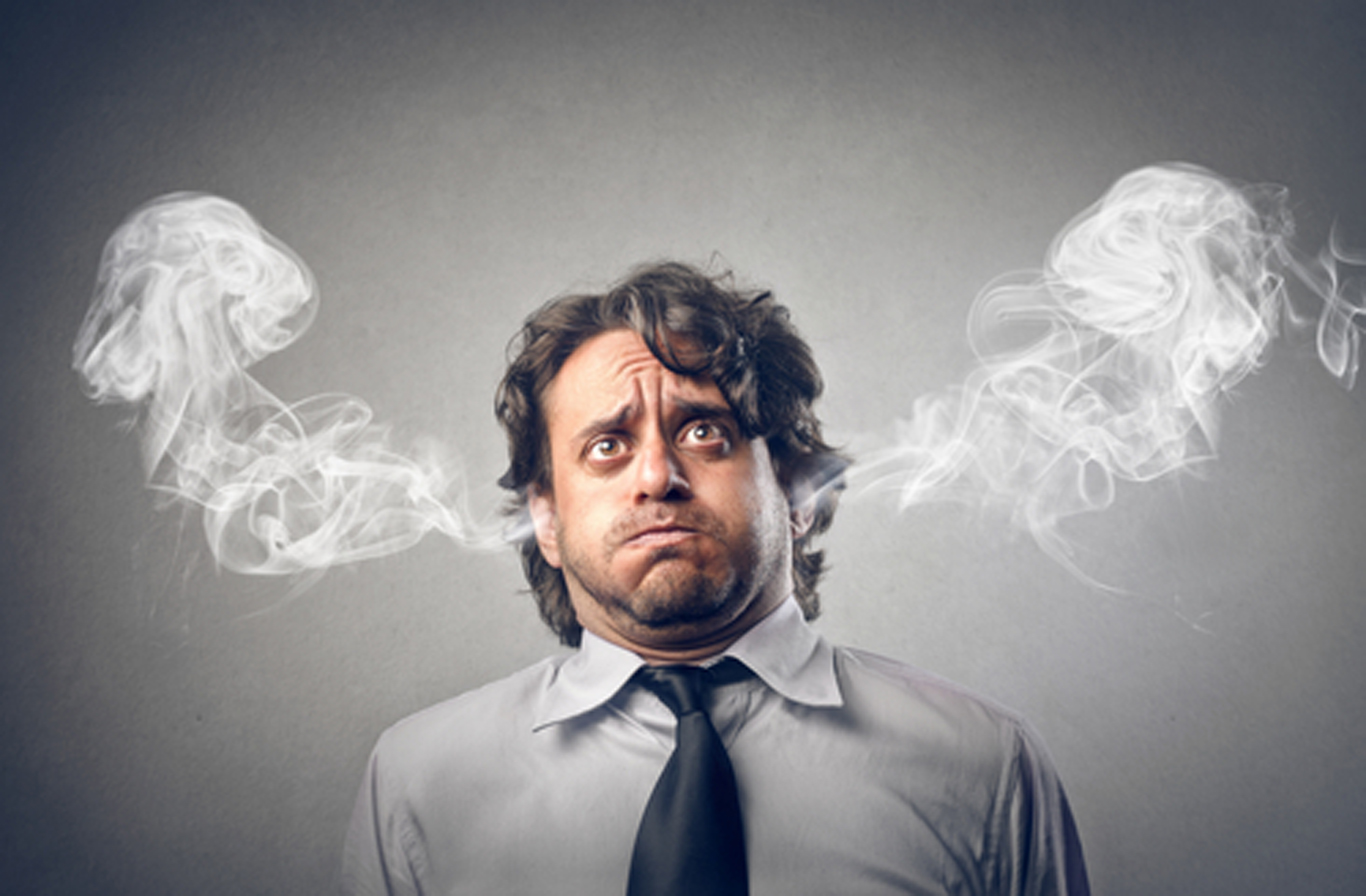 Stressed Out Businessman with Smoke Coming from Ears